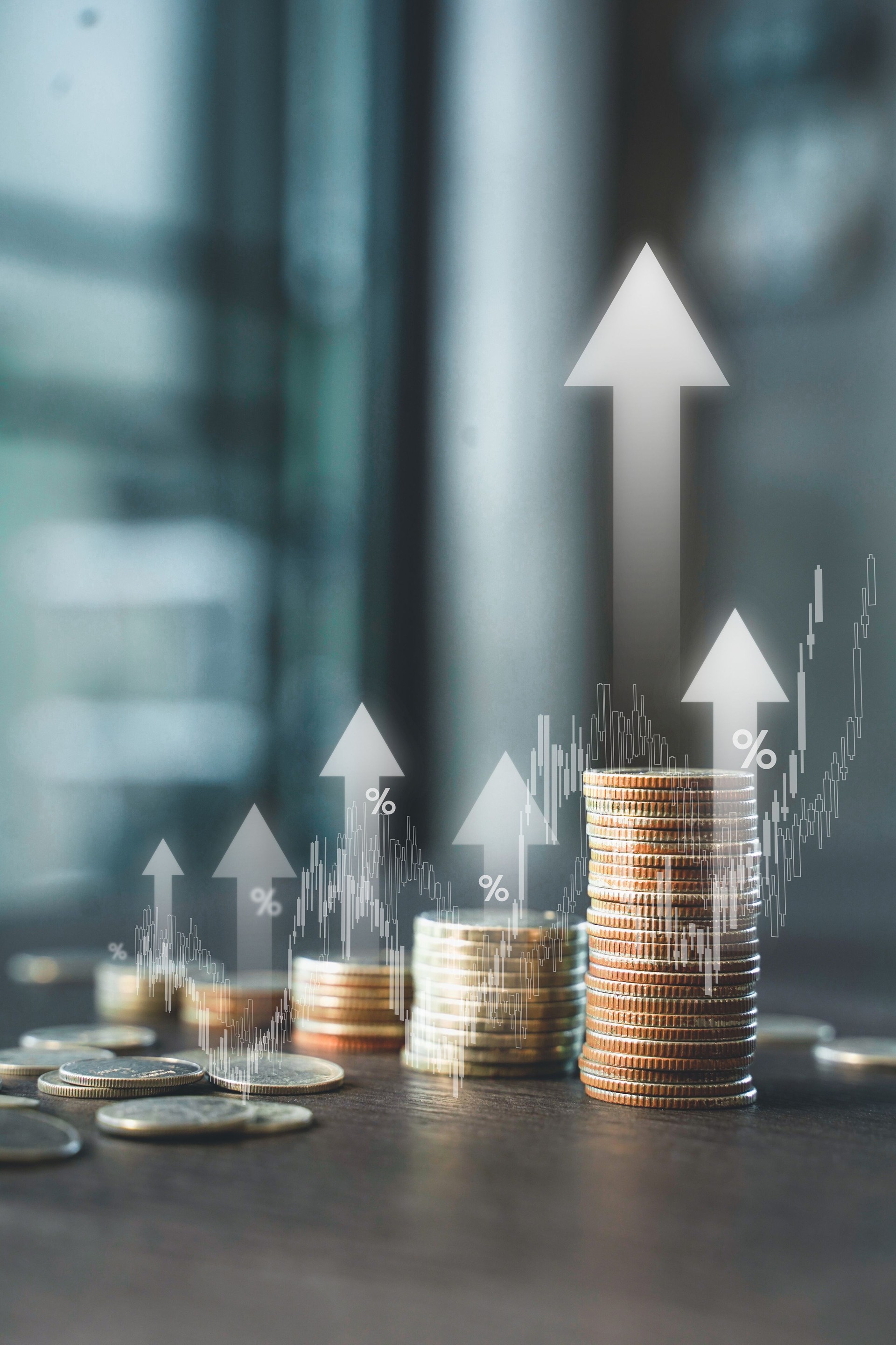 Stack of coins with up arrow and percentage symbol for finance bank increasing interest rate